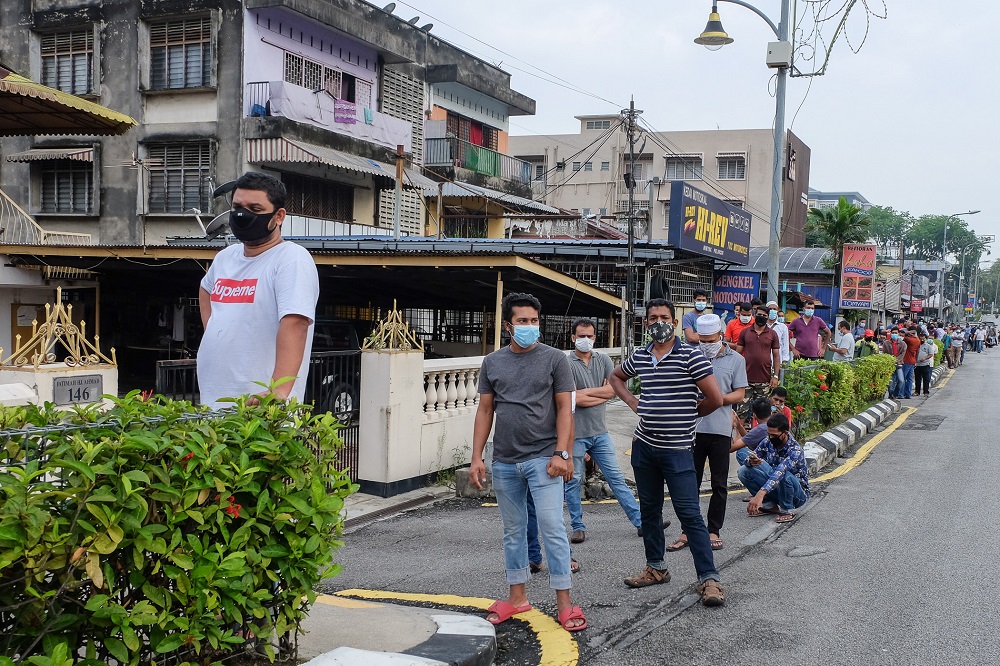 People are seen queuing up to be tested for Covid-19 at Kampung Baru in Kuala Lumpur May 8, 2020. u00e2u20acu2022 Picture by Yusof Mat Isa