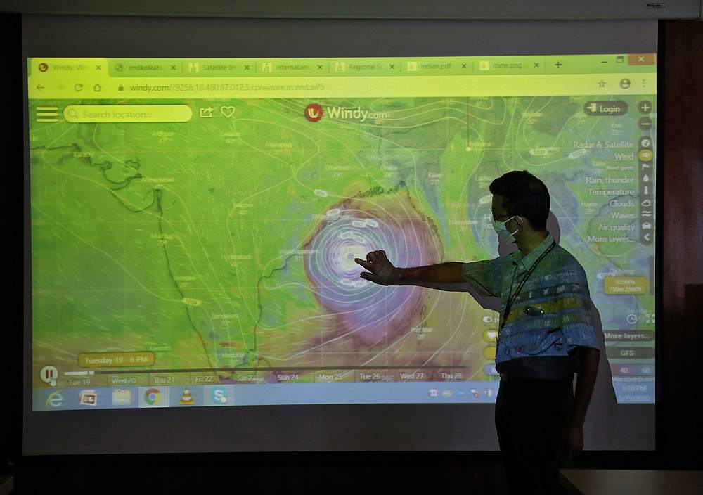 A scientist at India Meteorological Department Earth System Science Organisation, points to the position of the Cyclone Amphan inside his office in Kolkata, India May 19, 2020. u00e2u20acu201d Reuters pic