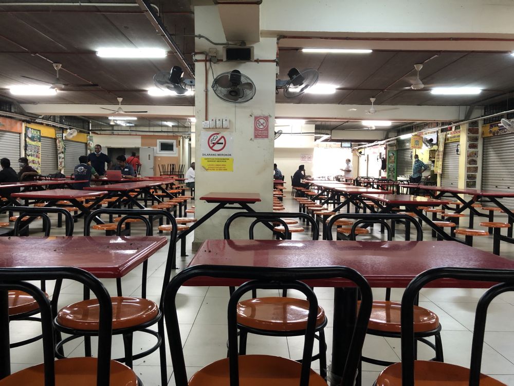 A general view of the food court within the Brickfields TLK Complex not complying with conditional movement control order SOP. u00e2u20acu201d Picture by Emmanuel Santa Maria Chin
