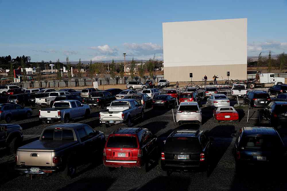 People sit in their cars during a drive-in Easter service at the Tru Vu Drive In theatre in Delta, Colorado April 12, 2020. u00e2u20acu201d Reuters pic