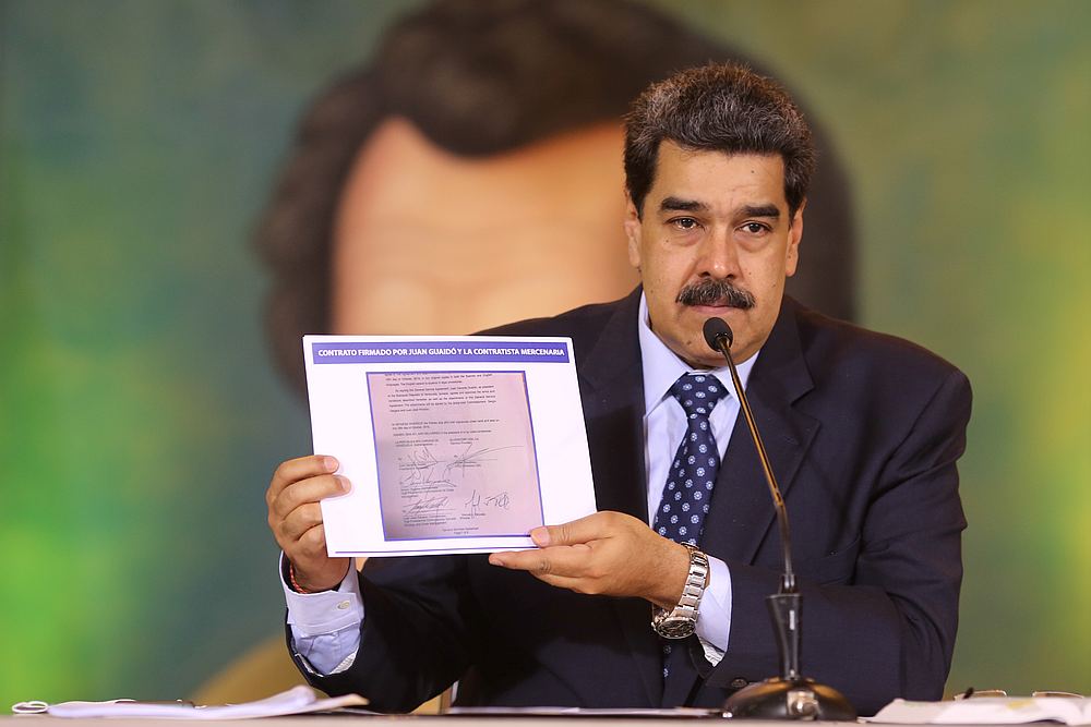 Venezuela's President Nicolas Maduro holds a document during a virtual news conference in Caracas, Venezuela May 6, 2020. u00e2u20acu201d Miraflores Palace handout via Reuters