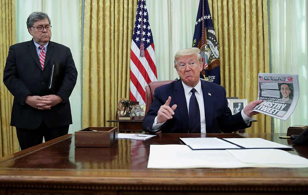 US President Donald Trump speaks to reporters about an executive order regarding social media companies as Attorney General Bill Barr listens in the Oval Office of the White House, Washington May 28, 2020. u00e2u20acu201d Reuters pic
