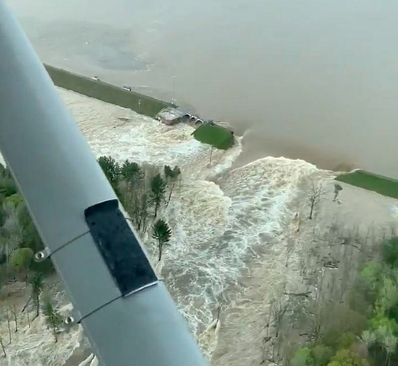 Aerial view of water from a broken Edenville Dam seen flooding the area as it flows towards Wixom Lake in Michigan May 19, 2020. u00e2u20acu201d Ryan Kaleto/Social Media video image via Reuters