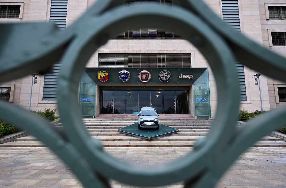 A car is displayed at the entrance of the FCA Italy headquarters, as the Mirafiori plant resumes  operations amid the Covid-19 outbreak in Turin, Italy April 27, 2020. u00e2u20acu201d Reuters pic