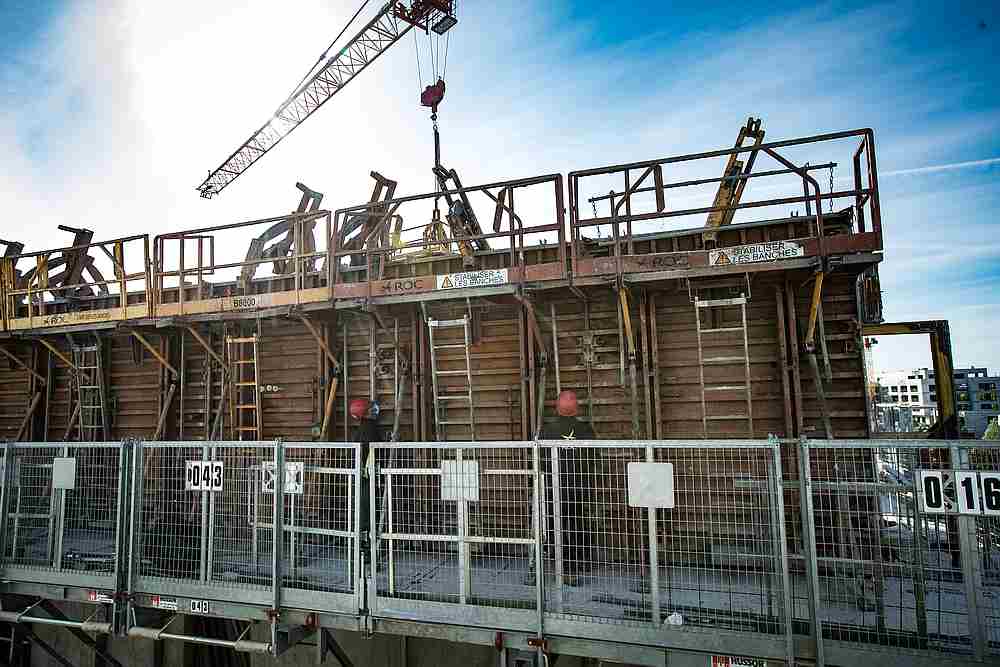 The ROC construction company workers wearing protective masks install equipment on a construction site in Montevrain, near Paris, France May 12, 2020. u00e2u20acu201d Pool pic via Reuters