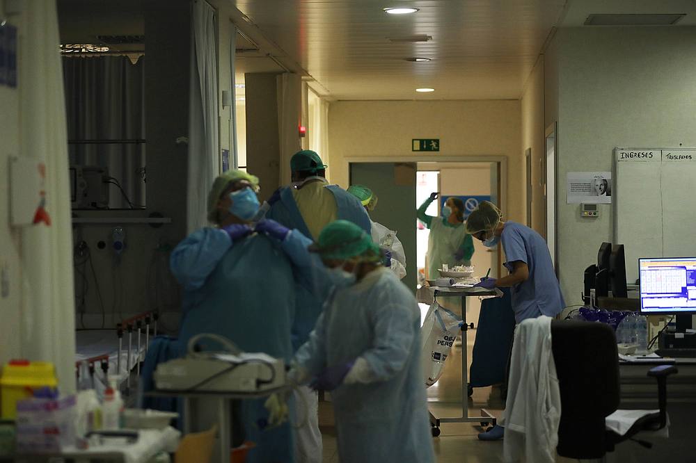 Healthcare workers in protective gear care for patients at the emergency room in Madrid, Spain, May 8, 2020. u00e2u20acu201d Reuters pic
