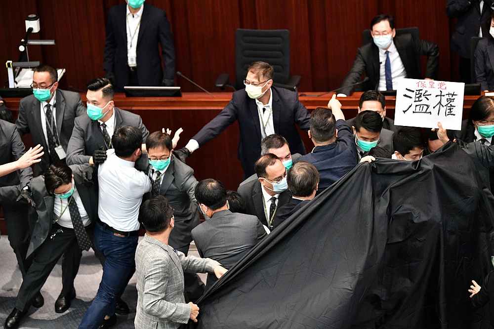 Pro-democracy and pro-Beijing lawmakers scuffle at the House Committeeu00e2u20acu2122s election of chairpersons at the Legislative Council in Hong Kong May 18, 2020. u00e2u20acu201d AFP pic