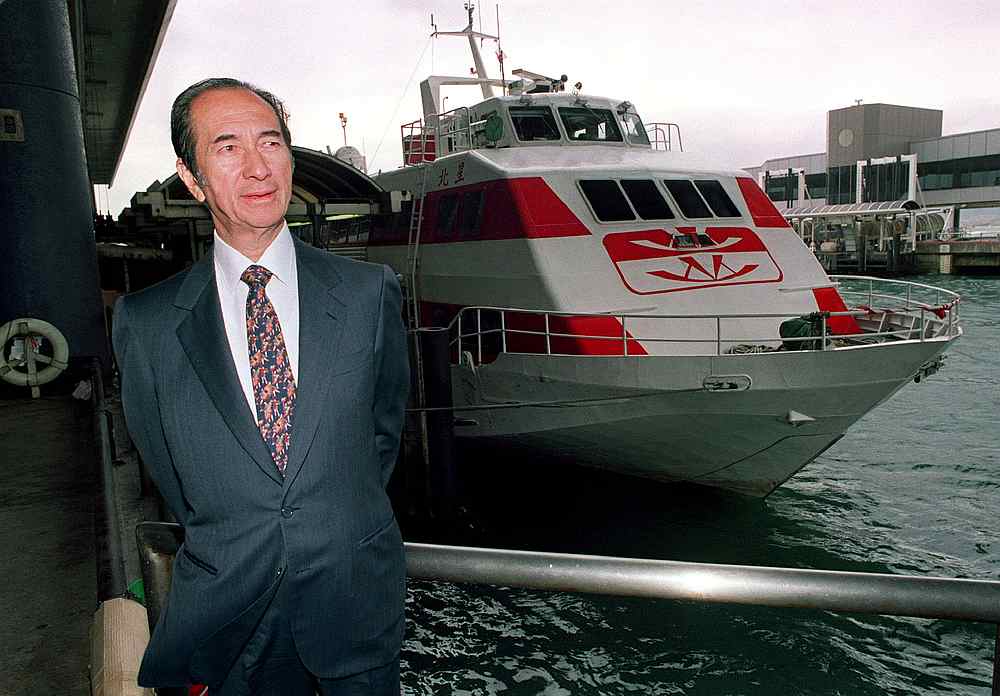 Tycoon Stanley Ho looks out from the Macau Ferry Terminal and in the background berths his latest in a fleet of jetfoils from his Hong Kong flagship company Shun Tak Holdings Ltd, in Hong Kong u00e2u20acu201d Reuters file pic