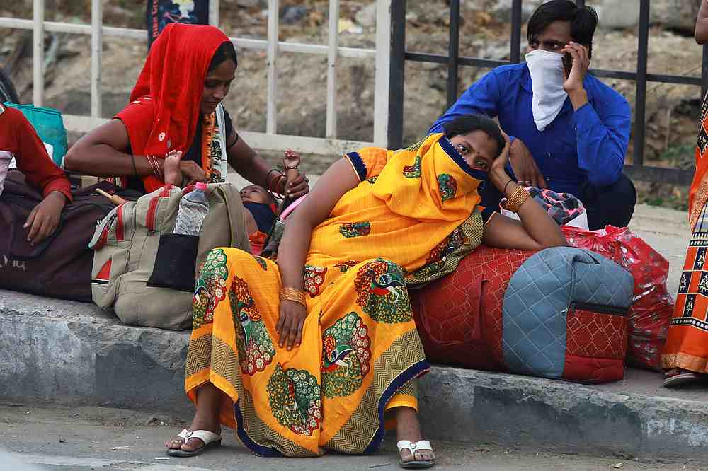 Migrant workers are seen waiting as they were stopped from crossing the border to their home state of Uttar Pradesh, in New Delhi, India May 14, 2020. u00e2u20acu201d Reuters pic