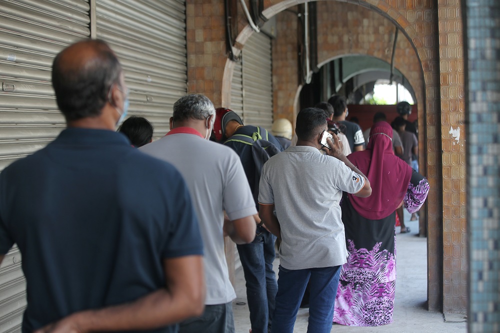 People queue up at a pawn shop in Ipoh May 5, 2020. u00e2u20acu2022 Picture by Farhan Najib