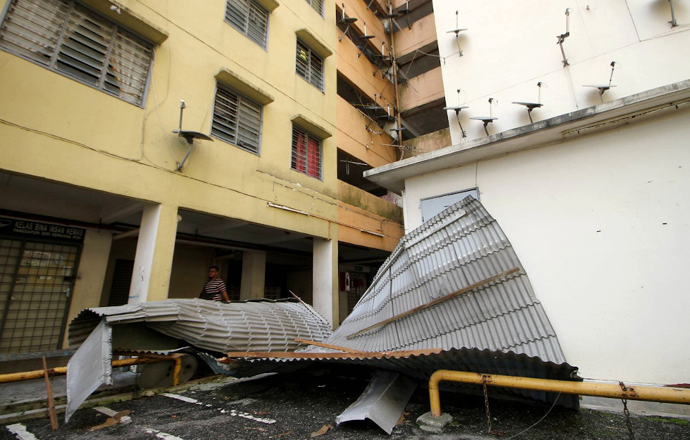 Strong winds blew off the roofs off seven units of the Seri Kepayang Apartment in Jalan Ghazali Jawi, Ipoh, yesterday. u00e2u20acu201d Bernama pic 