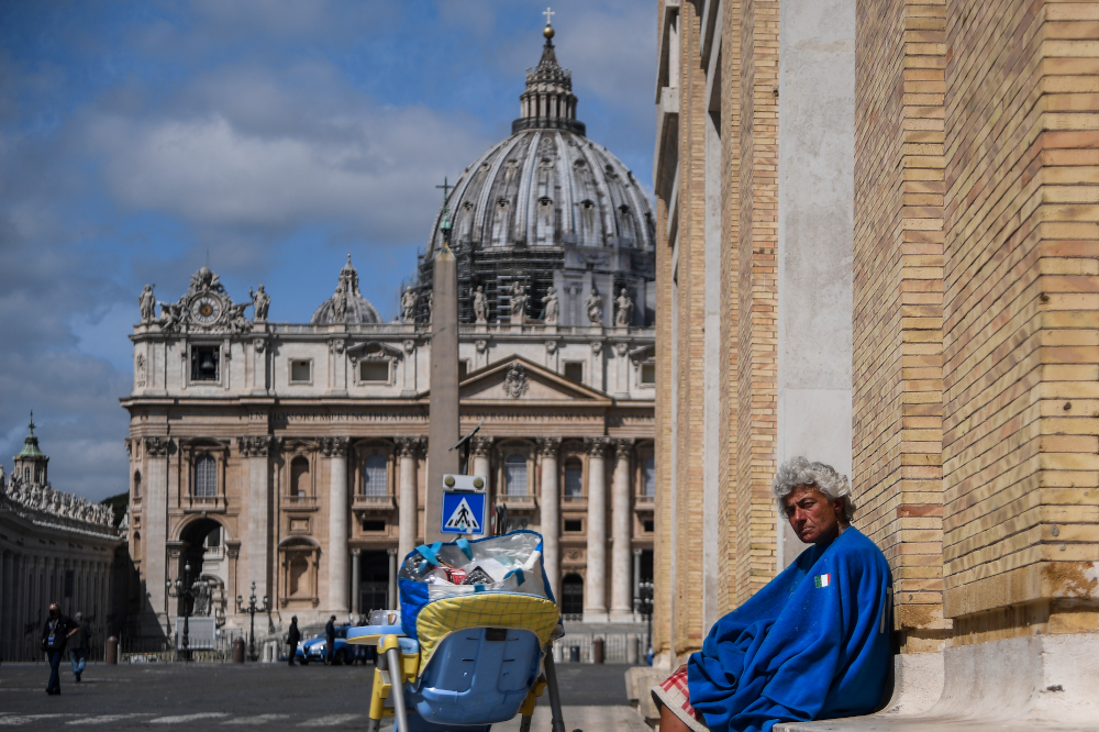 A homeless person sits on Via della Conciliazione in Rome near The Vatican, on May 6, 2020 during the lockdown. u00e2u20acu201d AFP pic 