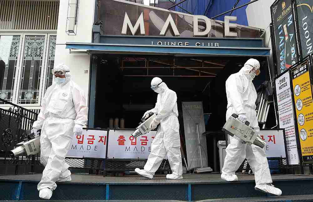 A worker sprays disinfectants in front of a night club in the Itaewon neighbourhood, following the Covid-19 outbreak, in Seoul, South Korea May 12, 2020. u00e2u20acu201d Yonhap pic via Reuters