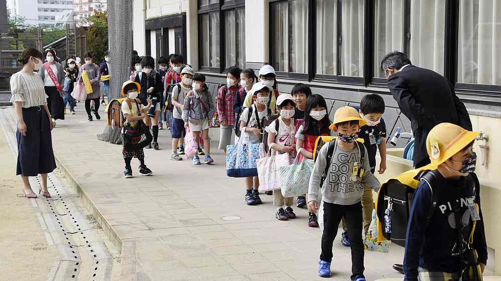 An elementary school reopens with students wearing face masks, following the Covid-19 outbreak, in Nagasaki, southern Japan May 11, 2020. u00e2u20acu201d Kyodo pic via Reuters