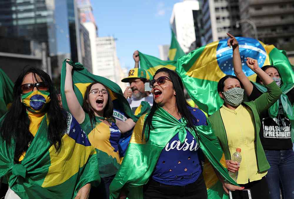 Supporters of far-right Brazilian President Jair Bolsonaro take part in a motorcade to protest against social distancing and quarantine measures in Sao Paulo, Brazil May 3, 2020. u00e2u20acu201d Reuters pic