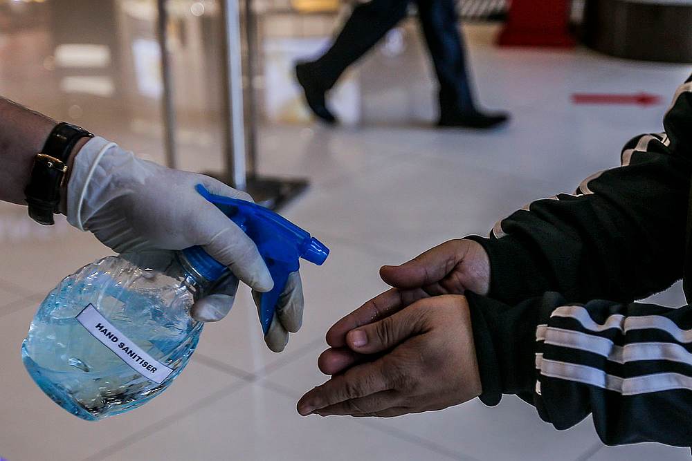 Shoppers' hands are sanitised before entering the mall at Sogo shopping complex at Jalan Tuanku Abdul Rahman, Kuala Lumpur May 4, 2020. u00e2u20acu201d Picture by Hari Anggara 