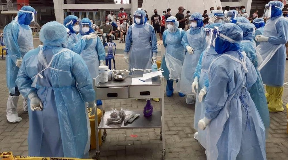 Johor Health Department staff prepare to screen students from several madrasahs in the state for the Covid-19 infection May 8, 2020. u00e2u20acu201d Picture courtesy of the Johor Health and Environment Committee office