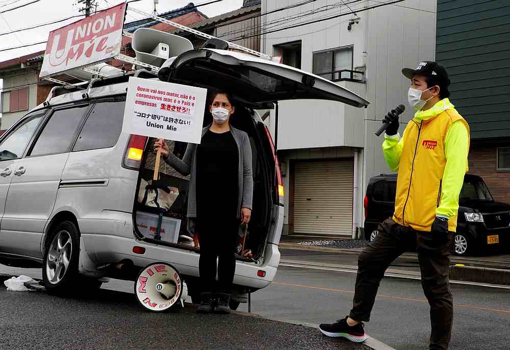 Kaori Nakao (left) and Akai Jimbu wearing protective masks take part in a protest against Nakao's firing in front of the factory she used to work at in Kiyosu, Aichi Prefecture, Japan April 20, 2020. u00e2u20acu201d Reuters pic 