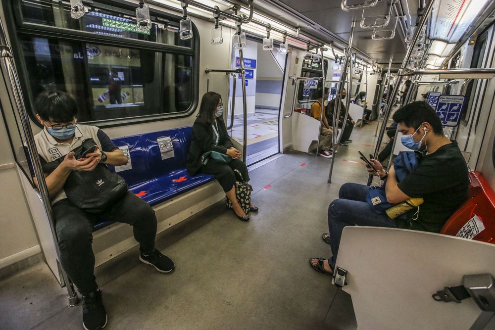 Commuters observe social distancing guidelines aboard the LRT on the first day of the conditional movement control order in Kuala Lumpur May 4, 2020. u00e2u20acu201d Picture by Hari Anggara