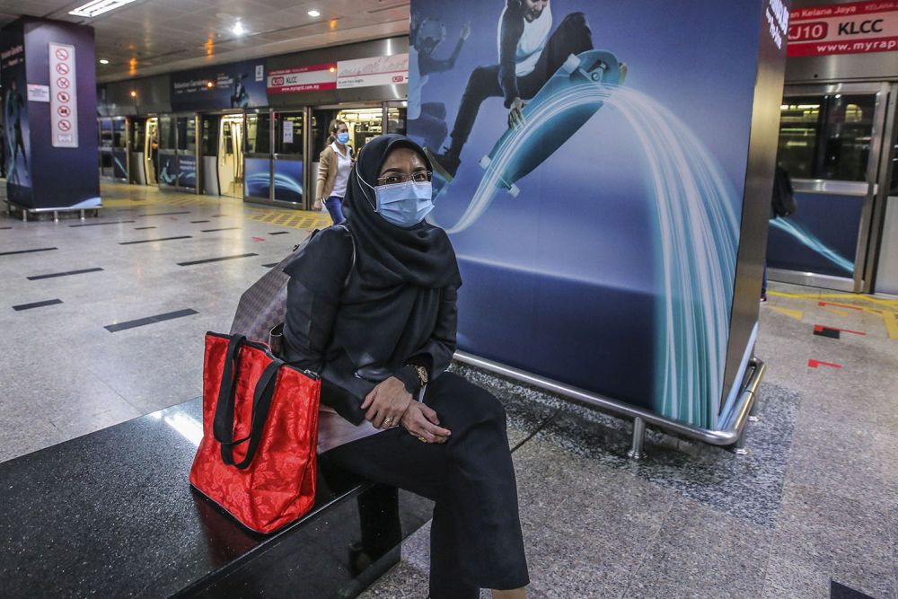 Commuter Fauziah Mat Jaafar speaks to Malay Mail while waiting for her train at the KLCC LRT station in Kuala Lumpur May 4, 2020. — Picture by Hari Anggara