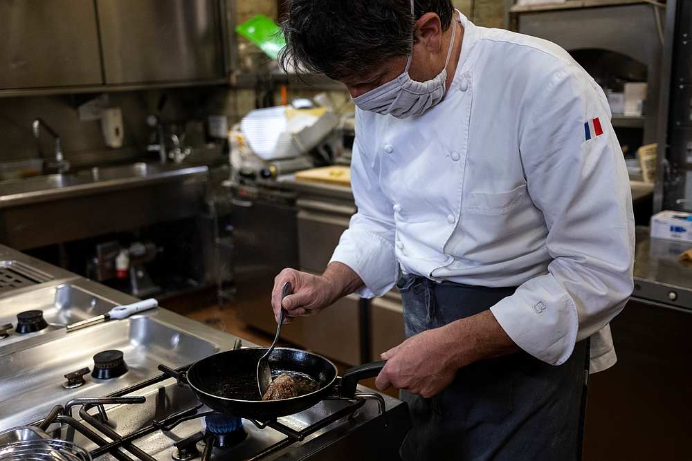 French chef Marc Lanteri wears a facemask as he cooks in his restaurant in the Castle of Grinzane in Grinzane Cavour, Langhe Unesco Heritage, northwestern Italy. u00e2u20acu201d AFP pic