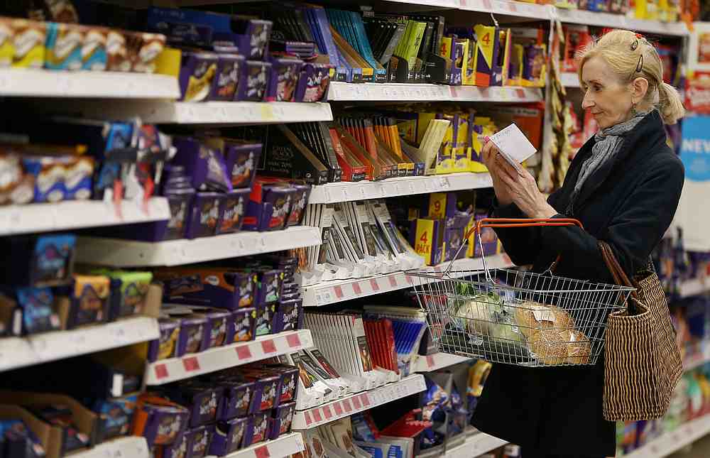 A shopper checks her shopping list in a supermarket in London, Britain April 11, 2017. u00e2u20acu201d Reuters pic