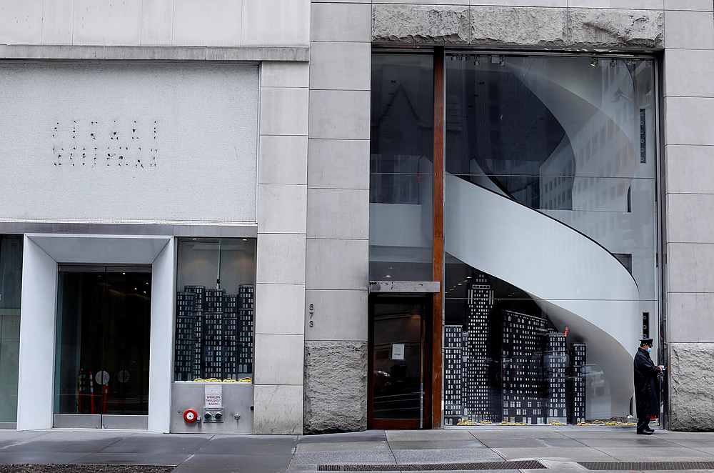 A security officer stands next to closed high-end retail stores along 5th Avenue, during the outbreak of Covid-19 in Manhattan, New York May 11, 2020. u00e2u20acu201d Reuters pic