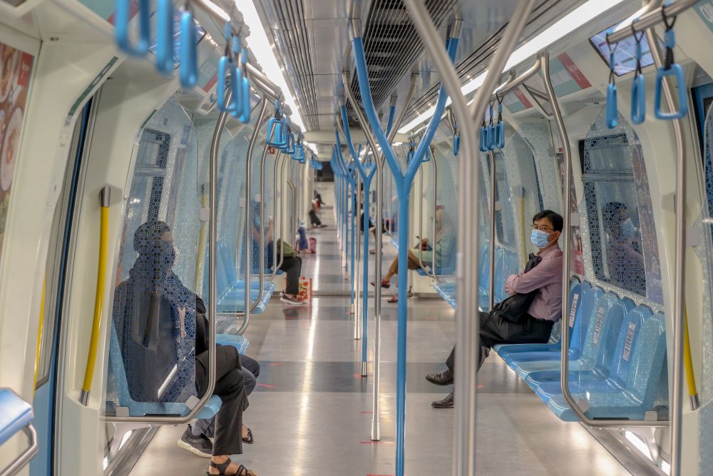 Commuters are pictured aboard an MRT train on the first day of the conditional movement control order in Kuala Lumpur May 4, 2020. u00e2u20acu201d Picture by Firdaus Latif