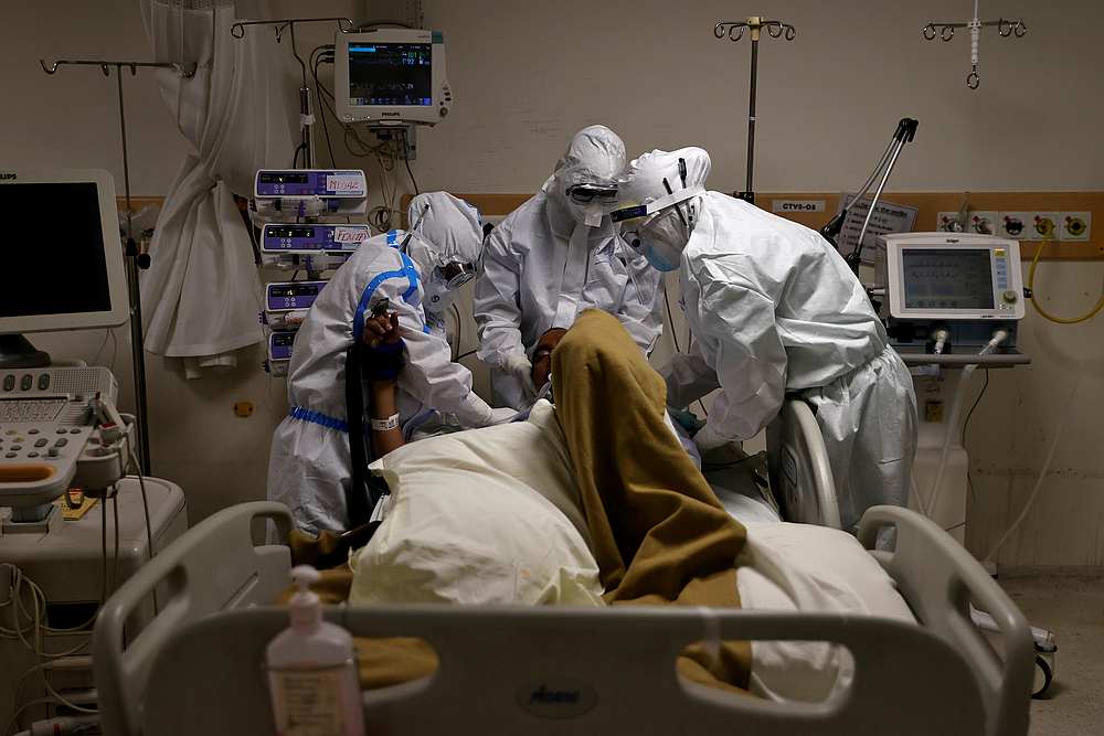 Medical workers wearing personal protective equipment (PPE) take care of a patient suffering from the Covid-19, at the ICU of the Max Smart Super Speciality Hospital in New Delhi, India May 28, 2020. u00e2u20acu201d Reuters pic