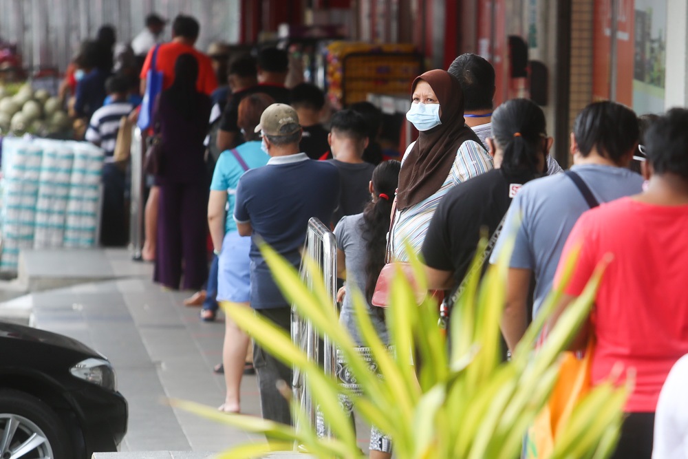 A long queue is seen in front of TMC Bangsar, May 1, 2020. u00e2u20acu2022 Picture by Choo Choy May
