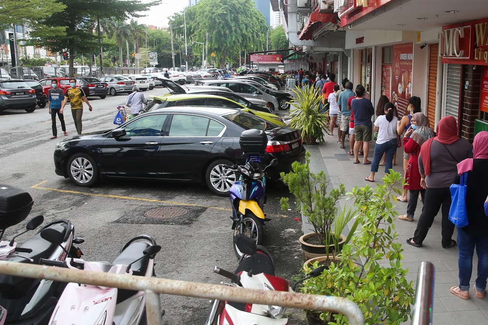 A long queue is seen in front of TMC Bangsar, May 1, 2020. u00e2u20acu2022 Picture by Choo Choy May