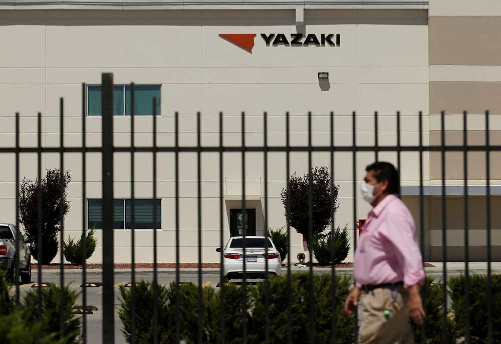 A man walks by the plant of the US automotive products supplier Yazaki, part of Japan-based Yazaki Group, after it announced layoffs among its Mexico workforce, in Ciudad Juarez, Mexico May 7, 2020. u00e2u20acu201d Reuters pic