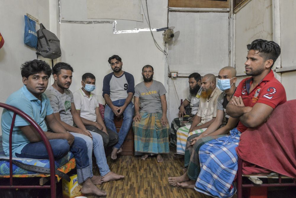 Shohel (middle) and his eight housemates. All of them were fasting but insisted on serving us tea. u00e2u20acu201d Picture by Shafwan Zaidon
