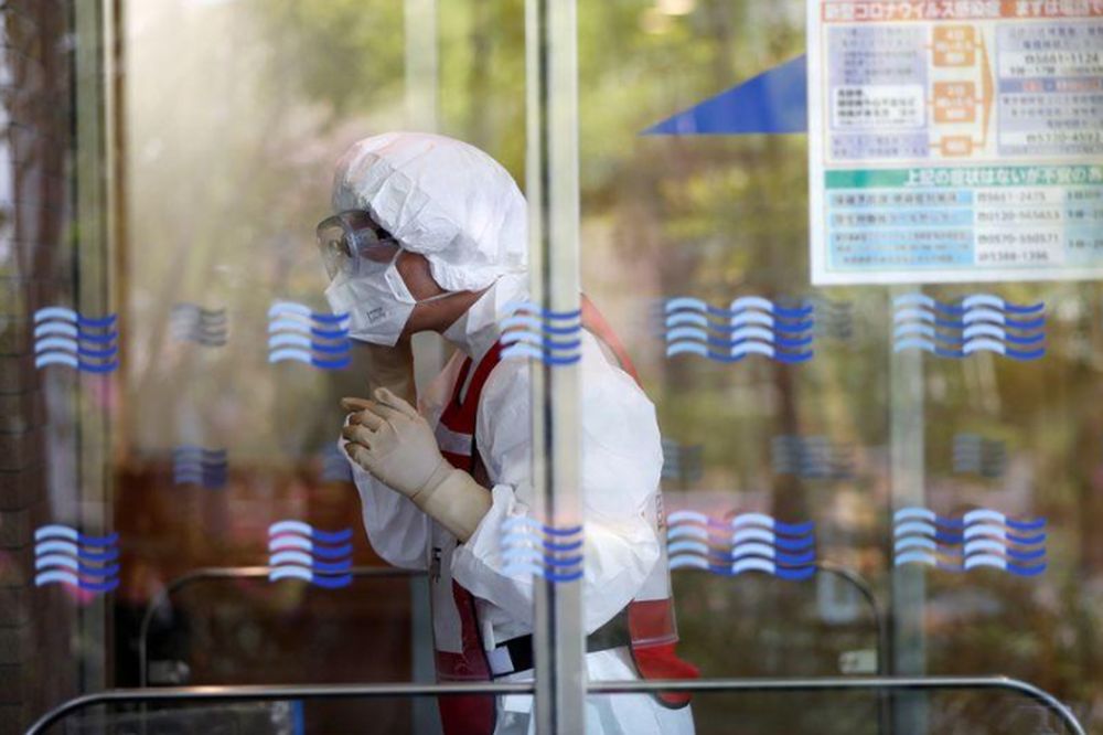A doctor wearing an N95 mask prepares a simulation for drive-through polymerase chain reaction (PCR) tests for the coronavirus disease (Covid-19) at Edogawa ward in Tokyo, Japan, April 22, 2020. u00e2u20acu201d Reuters pic