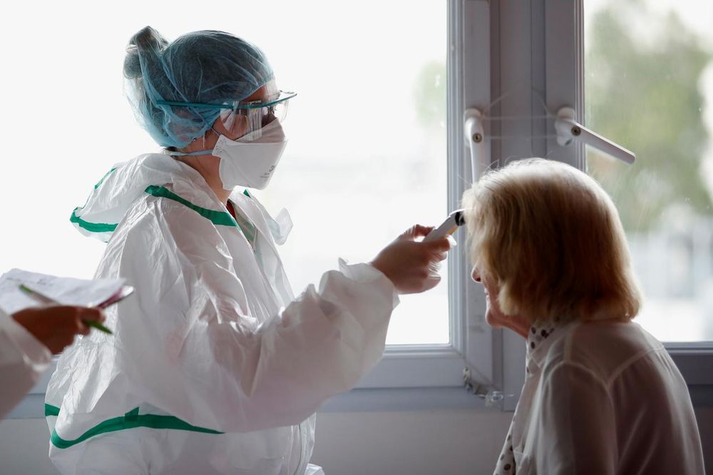 A nurse, wearing protective gear, checks the temperature of a patient at the post Covid-19 unit of the Clinique Breteche private hospital in Nantes, France, April 30, 2020. u00e2u20acu201d Reuters pic