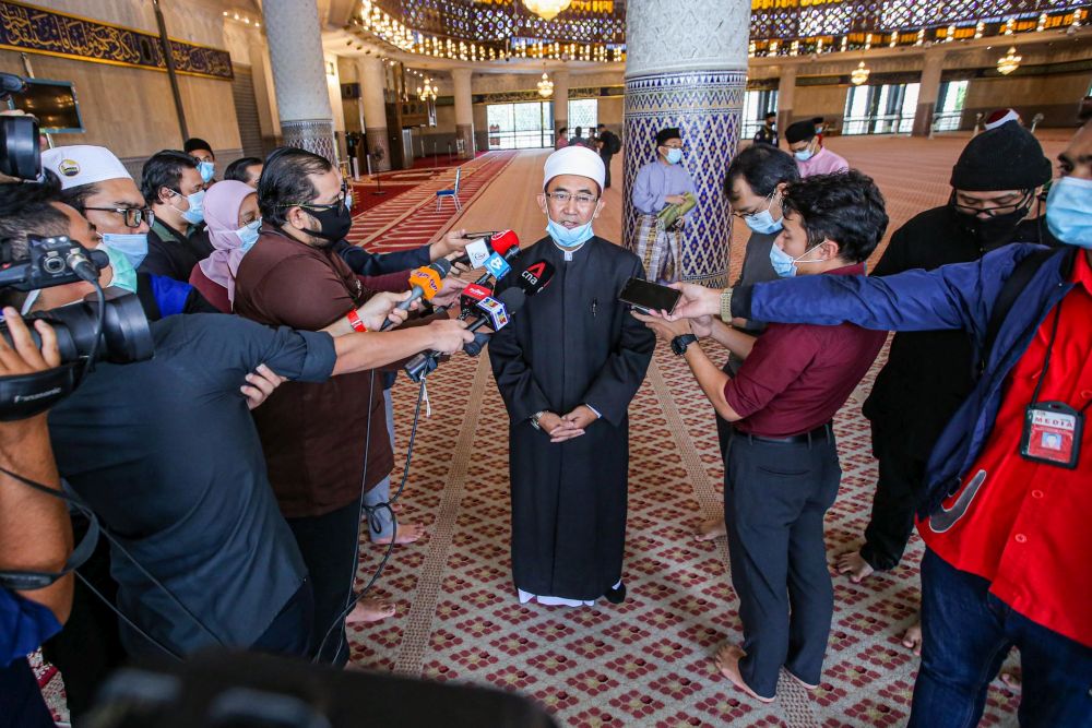 National Mosque High Priest Ehsan Mohd Husni speaks to reporter after Friday prayers in Kuala Lumpur May 15, 2020. — Picture by Hari Anggara