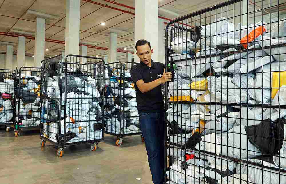 The Ninja Van warehouse team has been working around the clock to make sure parcels are distributed to their designated hubs in time for next-day deliveries. u00e2u20acu201d Picture courtesy of Ninja Van