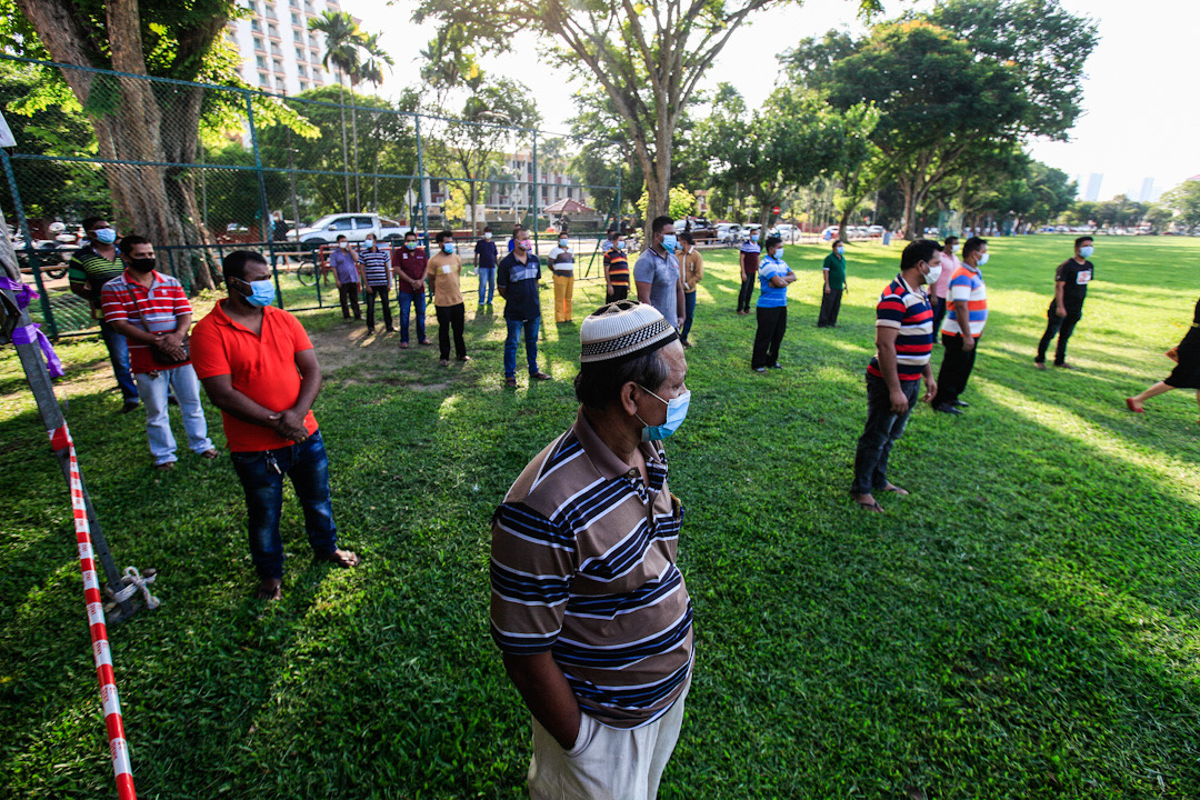 Foreign workers wait to be screened for Covid-19 at Padang Polo, George Town May 14, 2020. u00e2u20acu201d Picture by Sayuti Zainudin