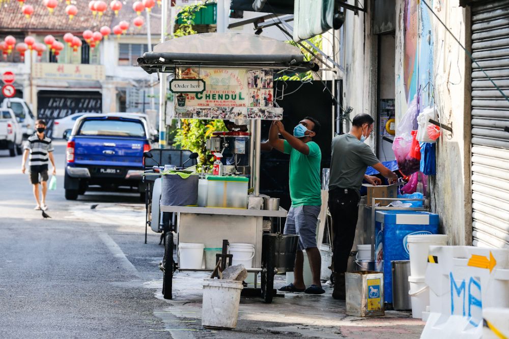 Business has dropped 70 per cent at Penang Road’s famous cendol stall due to the movement control order. — Picture by Sayuti Zainudin