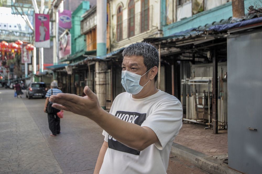 Teh Leong Tham, owner of Olsen Hotel, speaks to a reporter on Petaling Street, Kuala Lumpur May 4, 2020. — Picture by Shafwan Zaidon
