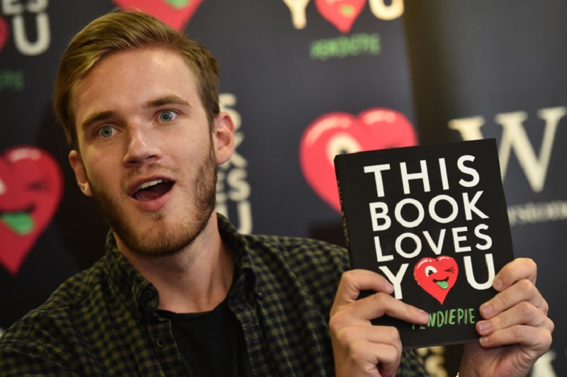 Swedish online star Felix Kjellberg aka PewDiePie with his book 'This book loves you' at an event in London, October 2015. u00e2u20acu2022 AFP pic