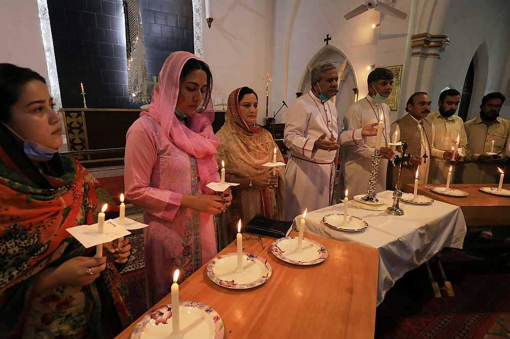 People light candles as they attend a prayer for victims of the Karachi plane crash, at the Cathedral Church of St John, in Peshawar, Pakistan May 23, 2020. u00e2u20acu201d Reuters pic