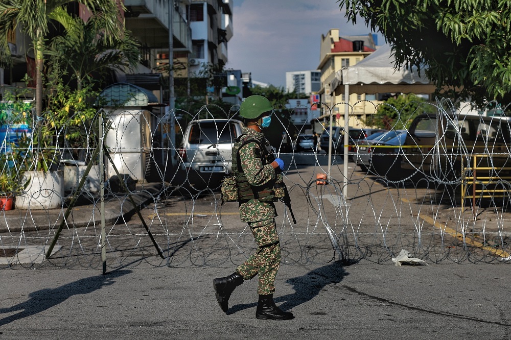 An Armed Forces personnel patrols the vicinity of Pudu in Kuala Lumpur May 15, 2020. u00e2u20acu201d Picture by Ahmad Zamzahuri