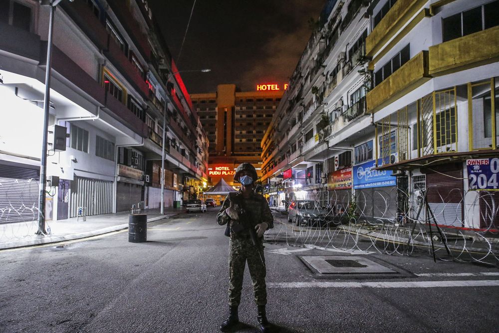 An Armed Forces personnel patrols the vicinity of Pudu in Kuala Lumpur May 15, 2020. — Picture by Hari Anggara