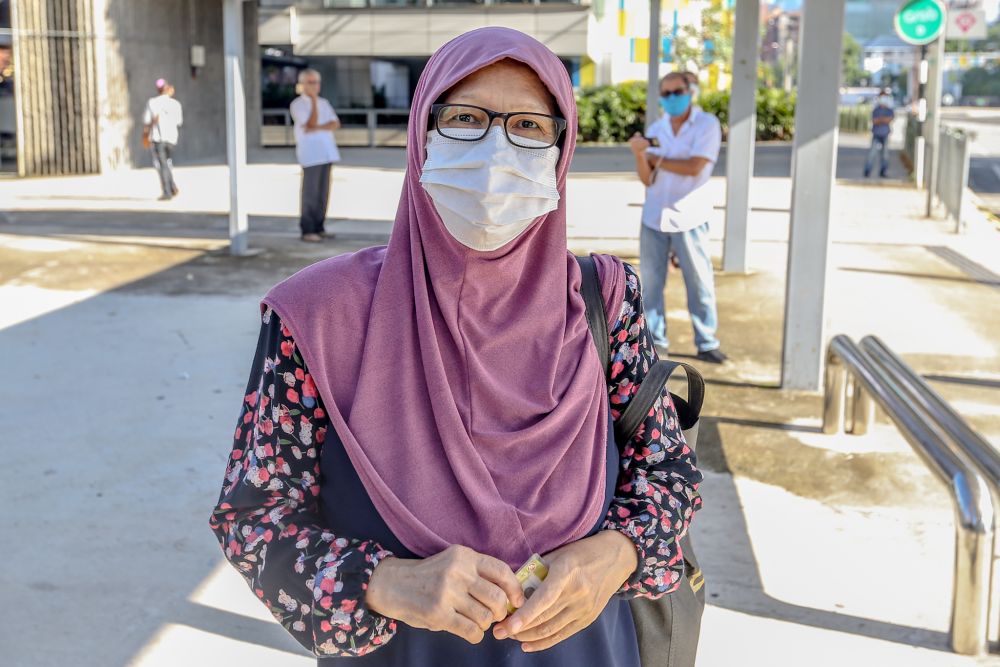 Salmah Yacob speaks to Malay Mail while waiting for her bus at the Taman Maluri LRT station in Kuala Lumpur May 4, 2020. — Picture by Firdaus Latif