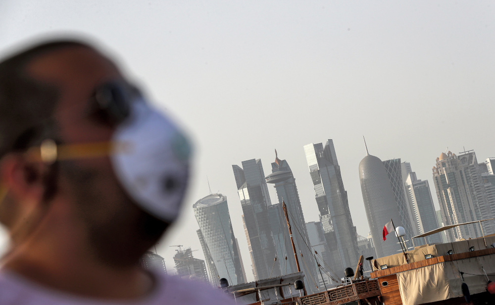 In this file photo taken March 16, 2020 A man wearing a mask as a precaution against Covid-19 coronavirus disease, walks along the Doha corniche in the Qatari capital. u00e2u20acu201d AFP pic 
