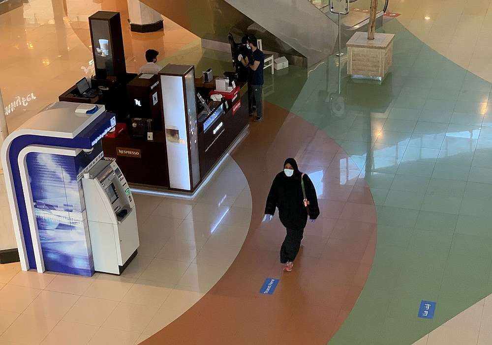A woman walks in the nearly deserted Hayat mall in the Saudi capital Riyadh, after the lockdown measures against Covid-19 were partially eased by the authorities May 14, 2020. u00e2u20acu201d AFP pic