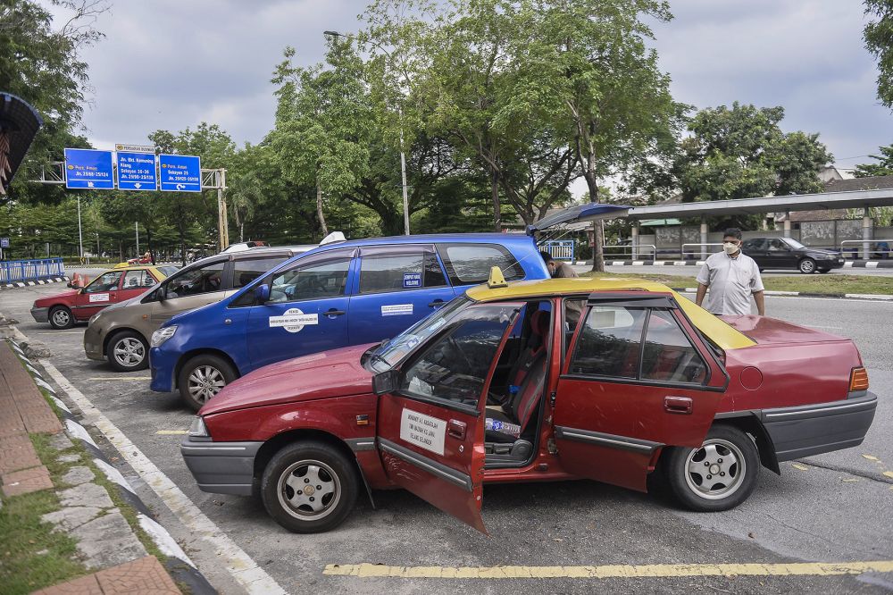 A taxi driver waits for passengers at a taxi station in Shah Alam during the conditional movement control order May 6, 2020. u00e2u20acu201d Picture by Miera Zulyana