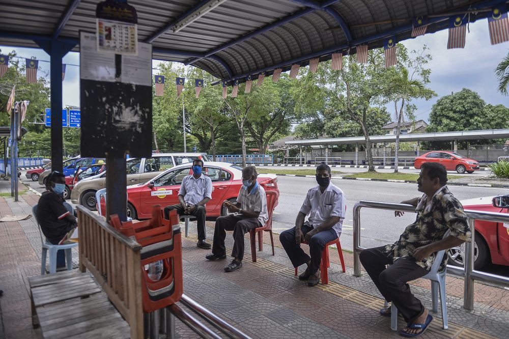 Taxi drivers wait for passengers at a taxi station in Shah Alam during the conditional movement control order May 6, 2020. u00e2u20acu201d Picture by Miera Zulyana