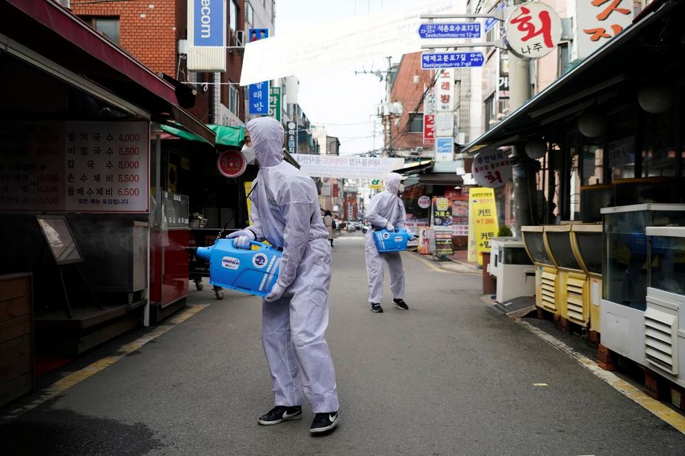 Employees from a disinfection service company sanitise a traditional market in Seoul, South Korea, February 26, 2020. u00e2u20acu201d Reuters pic